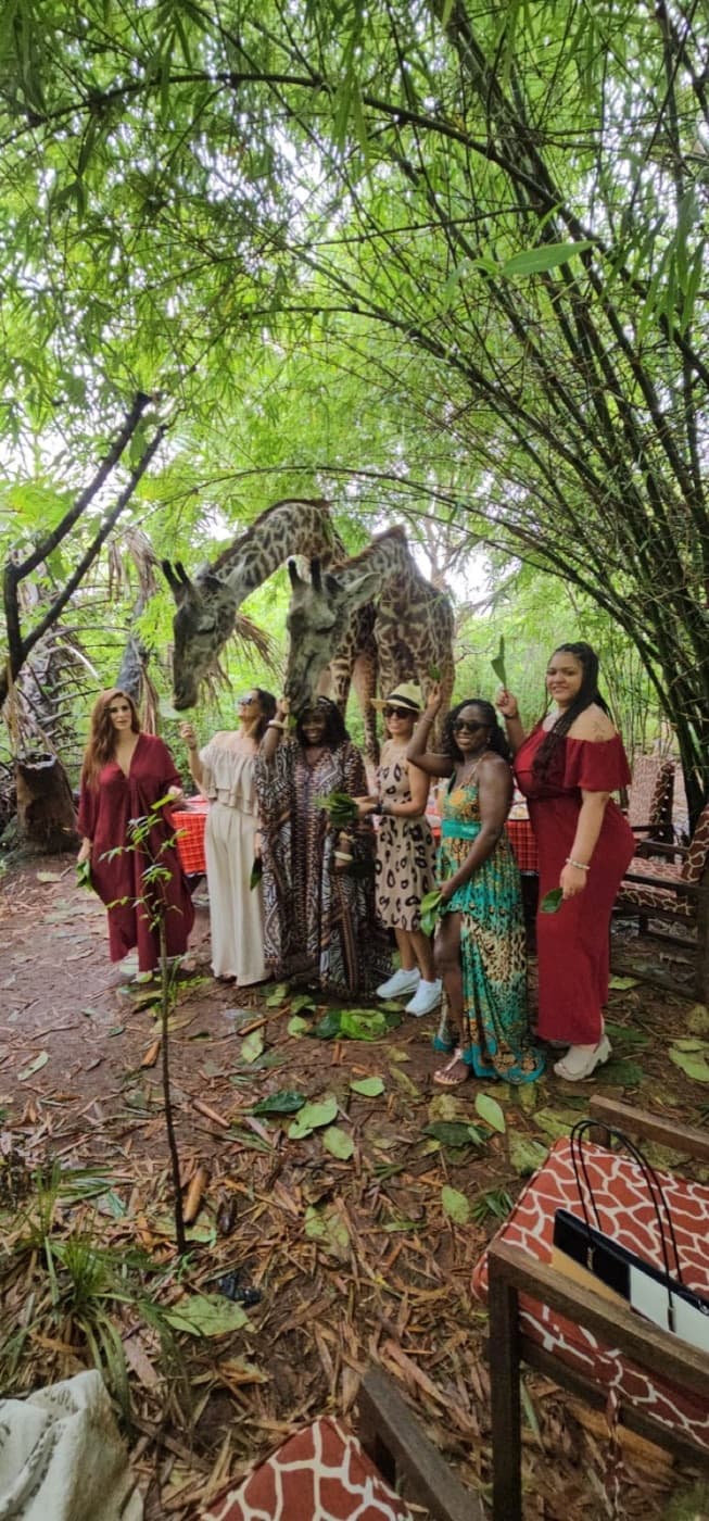 A group of travelers sharing a close giraffe encounter in Nairobi